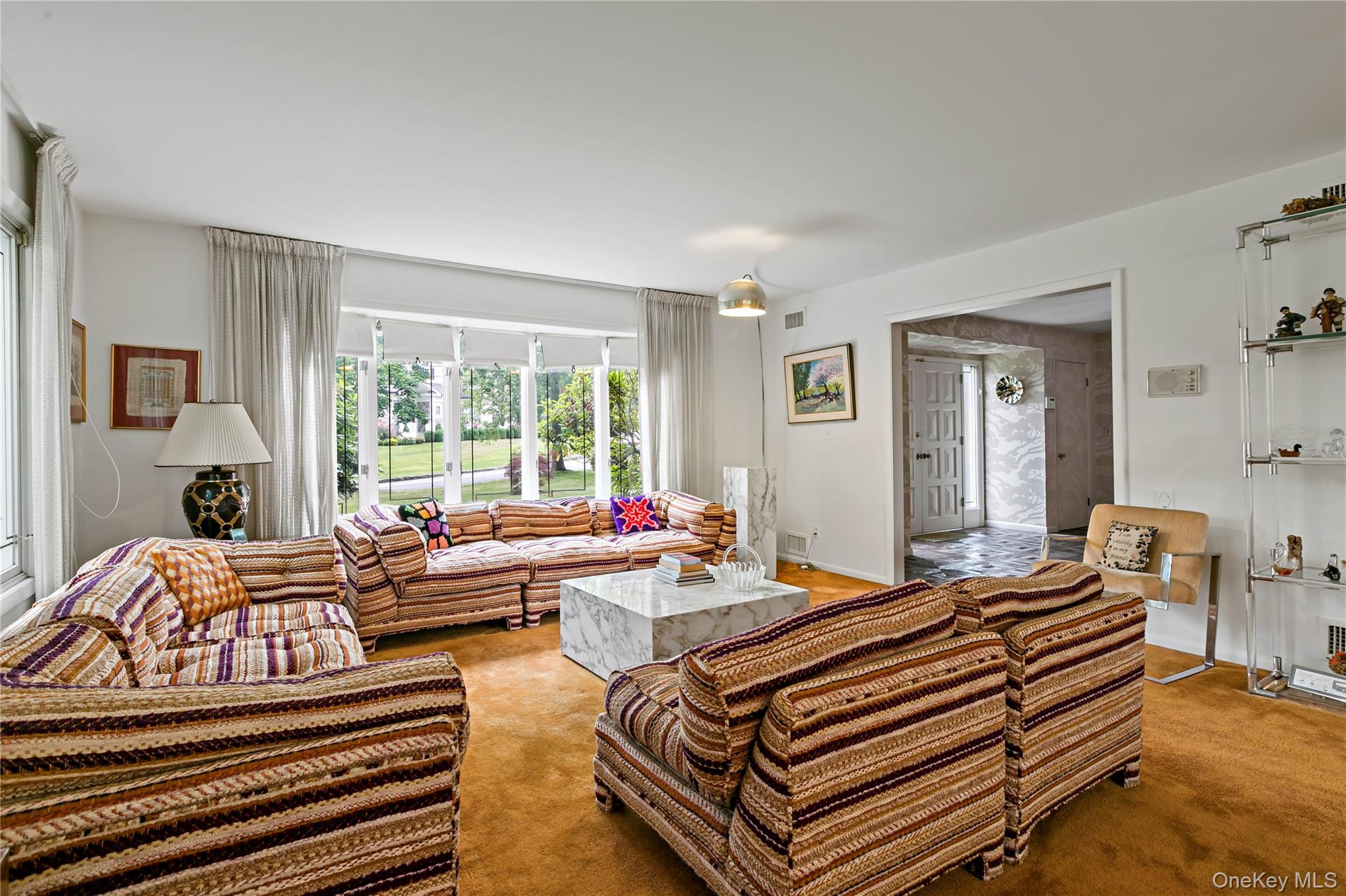 16 Meadow Road Scarsdale, NY 10583 - Photo 5 of 47 a living room with furniture and a large window