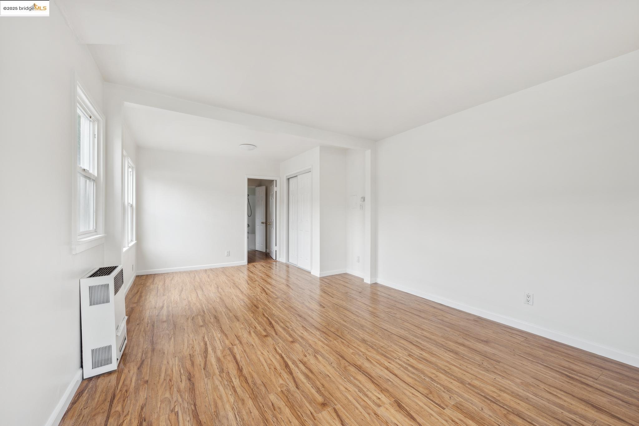 1226 Russell Street Berkeley, CA 94702 - Photo 13 of 32 a view of empty room with wooden floor and fan