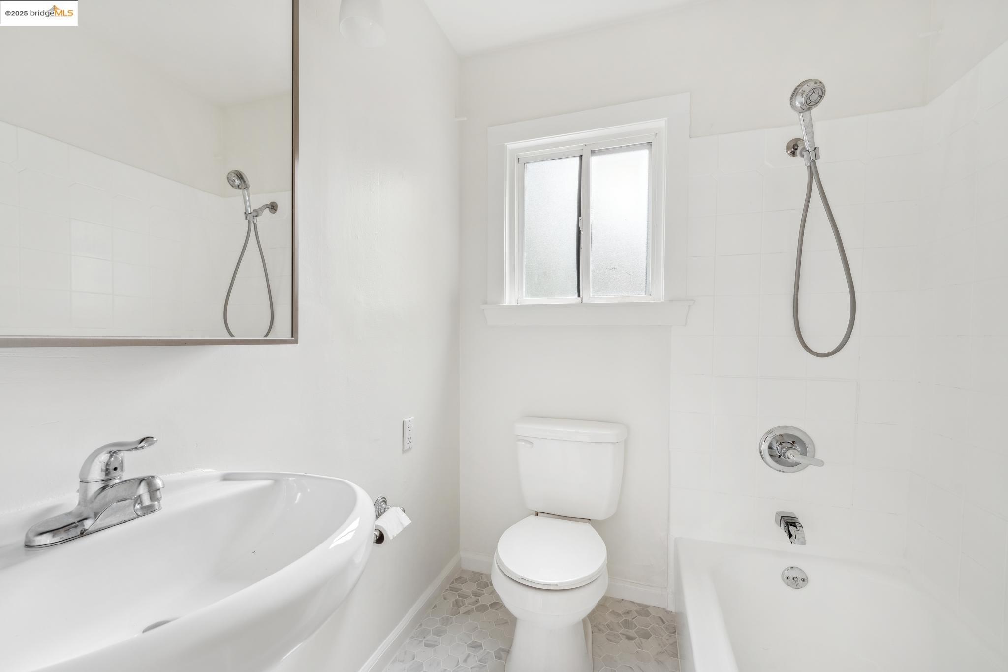 1226 Russell Street Berkeley, CA 94702 - Photo 14 of 32 a bathroom with a sink toilet and shower