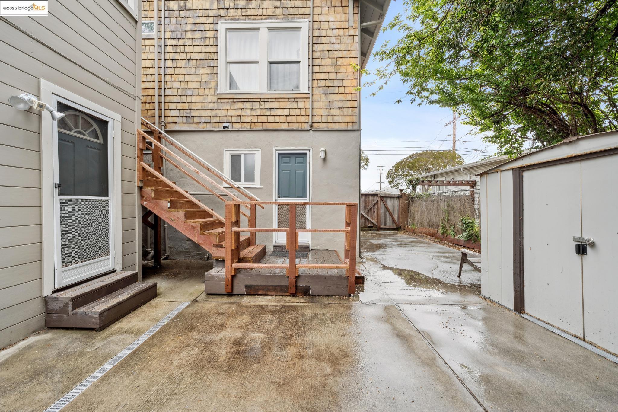 1226 Russell Street Berkeley, CA 94702 - Photo 17 of 32 a backyard of a house with barbeque oven and trees
