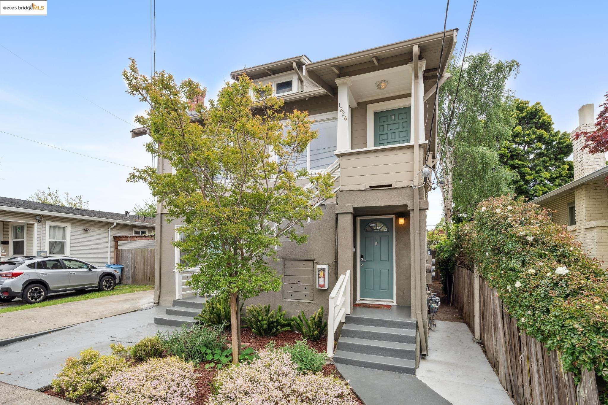 1226 Russell Street Berkeley, CA 94702 - Photo 2 of 32 a front view of a house with a yard