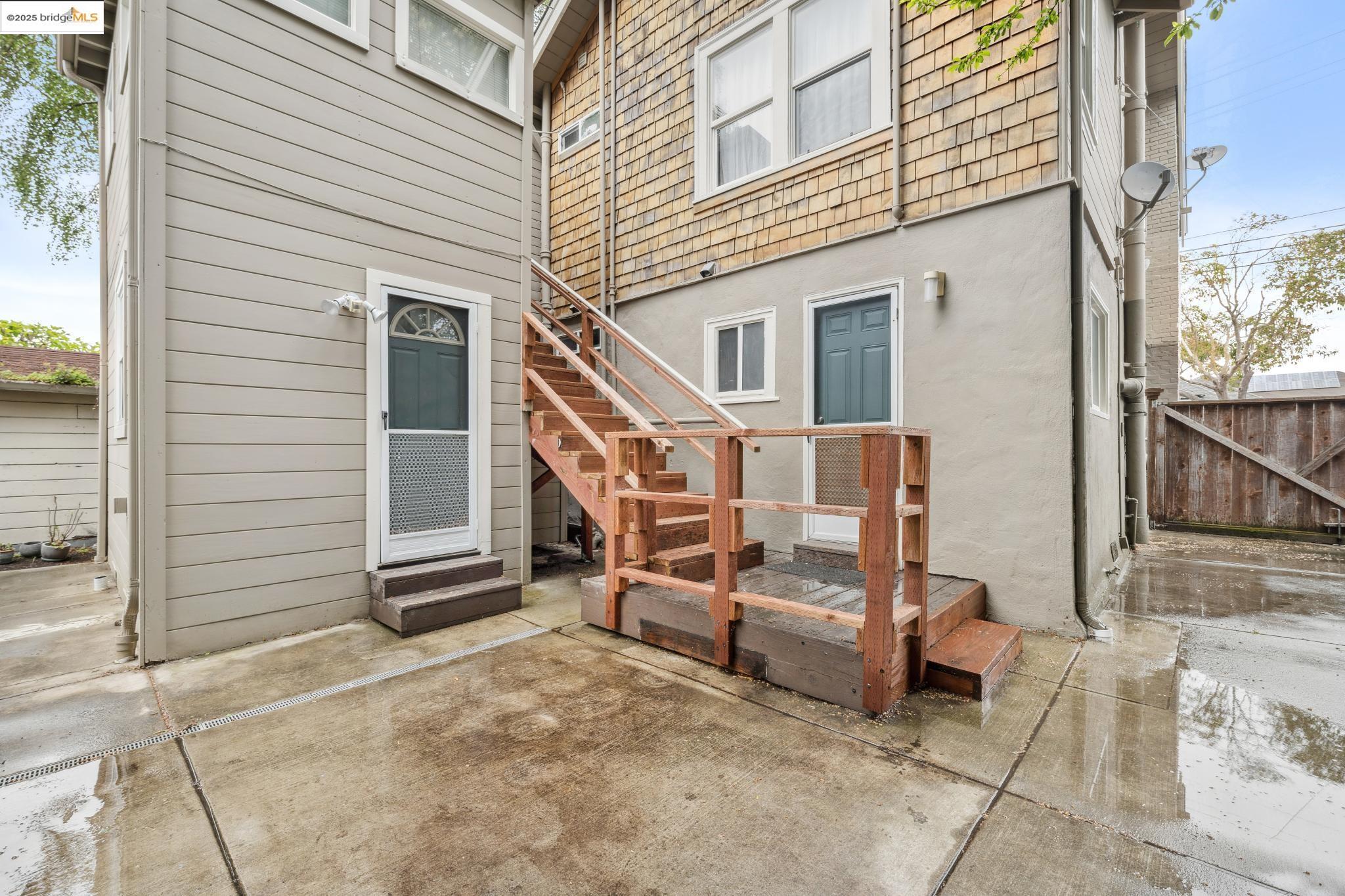 1226 Russell Street Berkeley, CA 94702 - Photo 21 of 32 a view of a house with a barbeque and wooden stairs