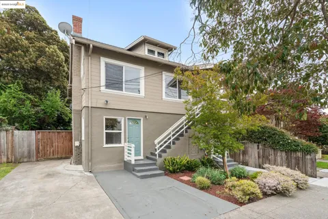 front view of a house with a small yard
