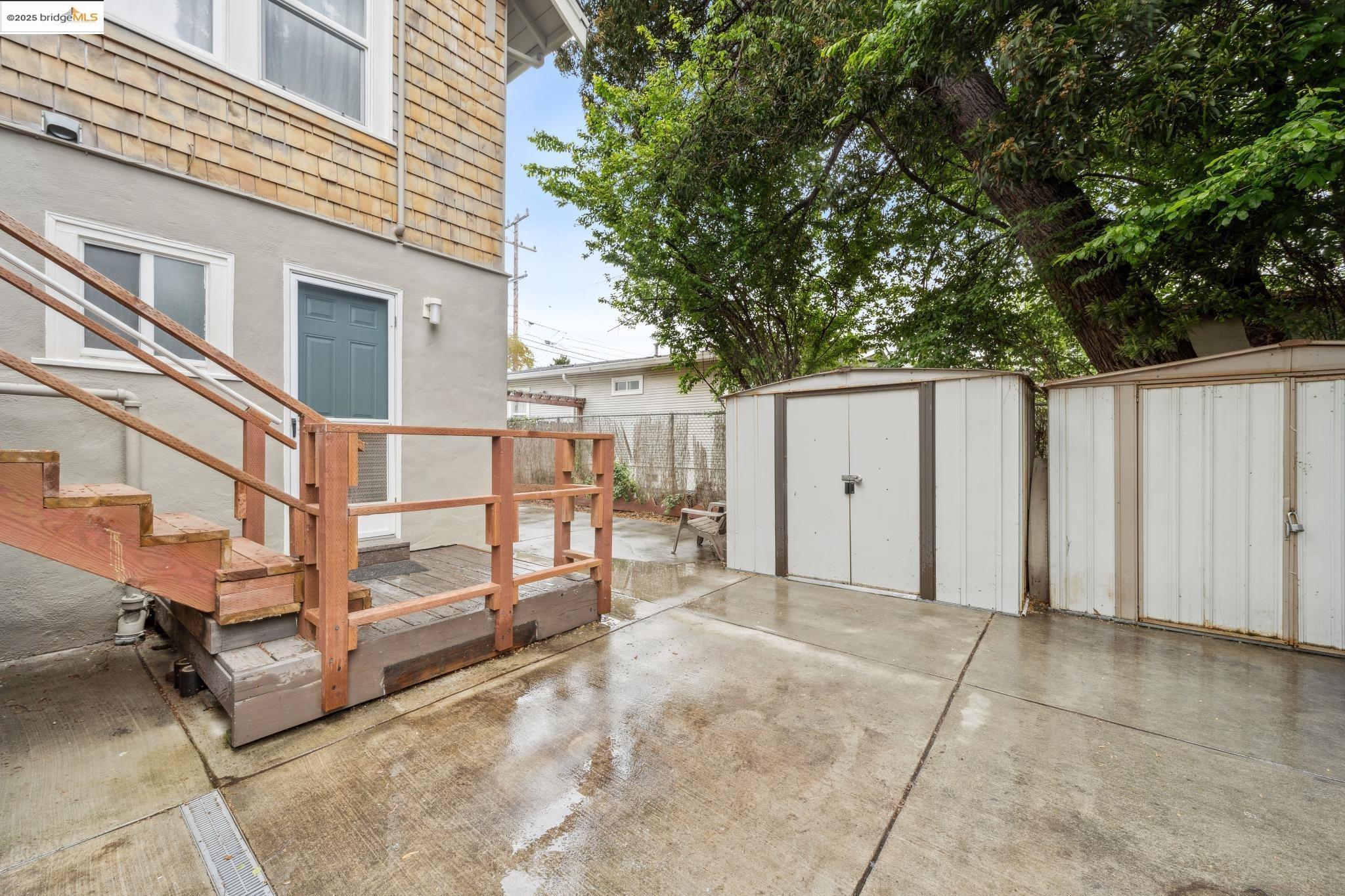 1226 Russell Street Berkeley, CA 94702 - Photo 9 of 32 a view of backyard with a large tree and wooden fence