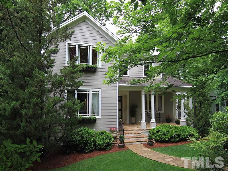 2327 Byrd Street Raleigh, NC 27608 - Photo 1 of 25 a front view of a house with a yard and potted plants