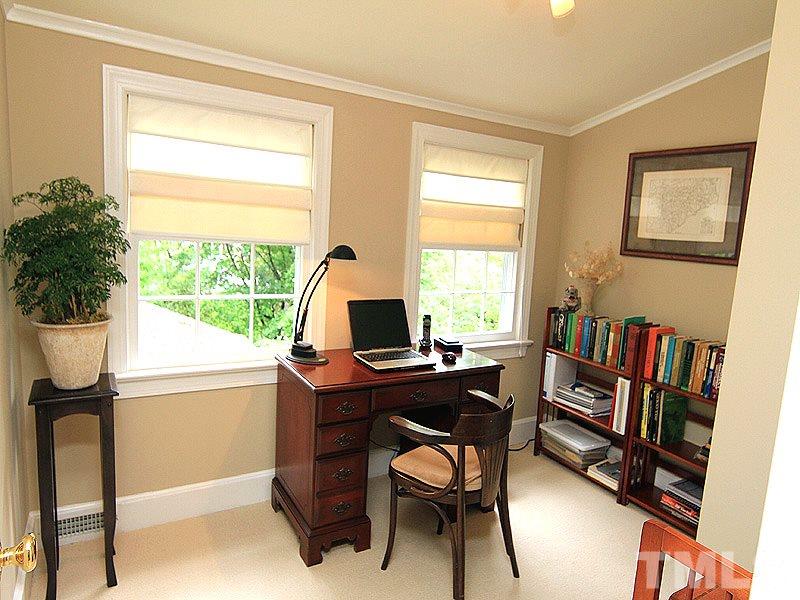 2327 Byrd Street Raleigh, NC 27608 - Photo 18 of 25 a view of a workspace with furniture and a window
