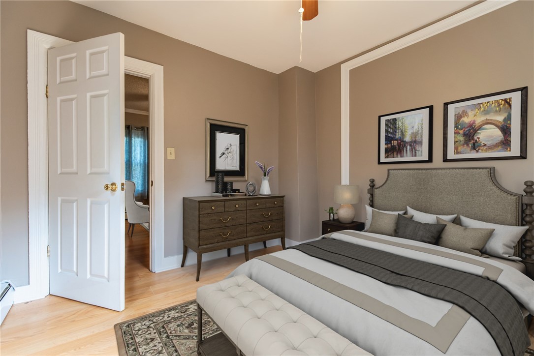 68 Northeast Street Woonsocket, RI 02895 - Photo 11 of 49 First floor primary bedroom off LR shared wall DR
Virtually Staged Photo