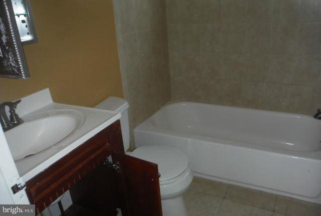 1800 Swansea Road Baltimore, MD 21239 - Photo 3 of 8 a bathroom with a sink and a bathtub