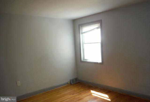 1800 Swansea Road Baltimore, MD 21239 - Photo 4 of 8 an empty room with a window