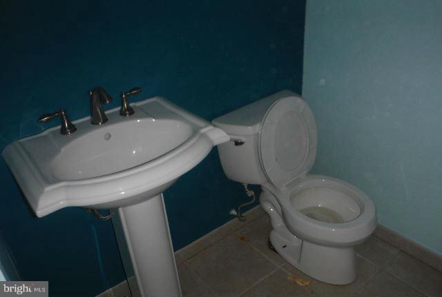 1800 Swansea Road Baltimore, MD 21239 - Photo 7 of 8 a bathroom with a toilet and a sink
