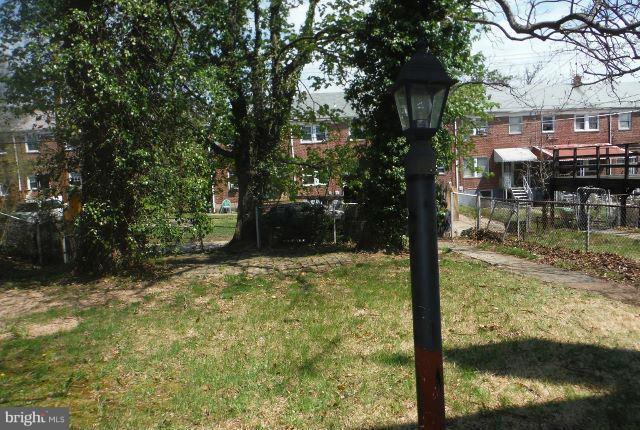 1800 Swansea Road Baltimore, MD 21239 - Photo 8 of 8 a backyard of a house with lots of green space