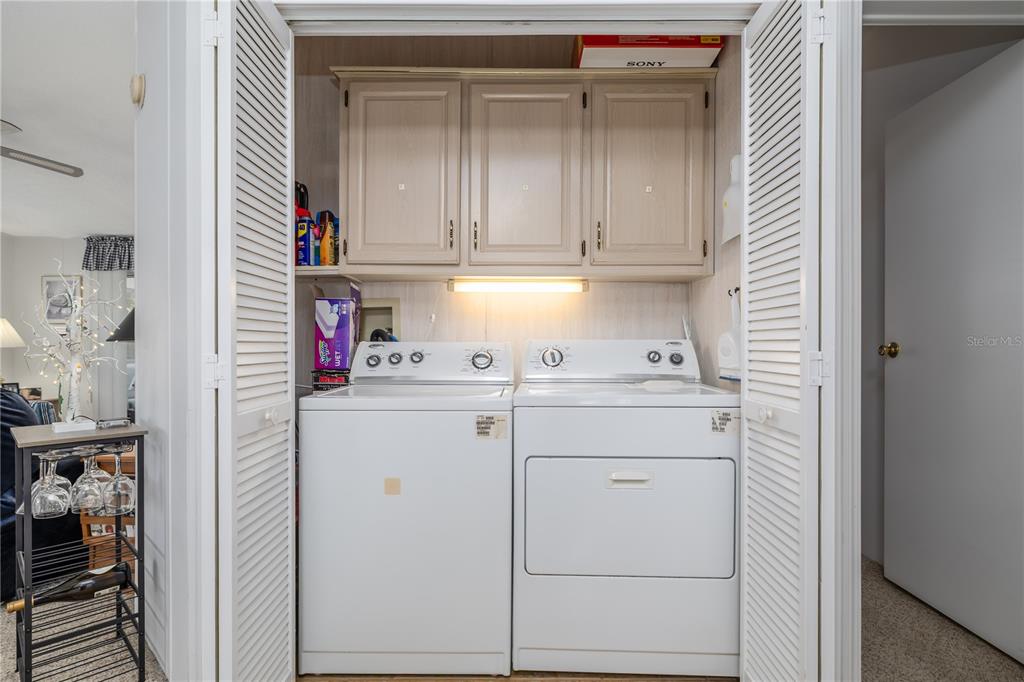810 Navigators Way Edgewater, FL 32141 - Photo 17 of 34 a kitchen with a sink and cabinets