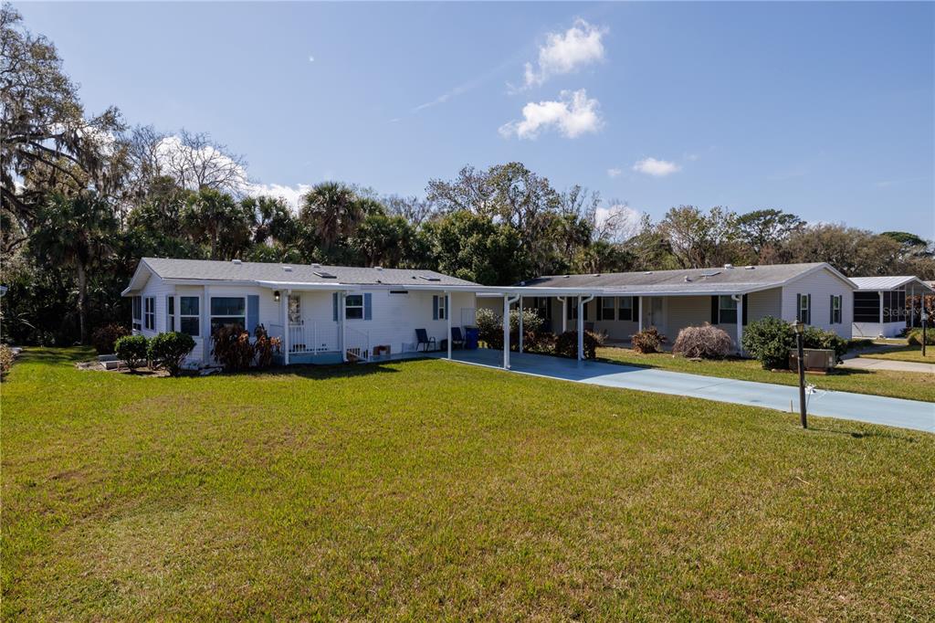 810 Navigators Way Edgewater, FL 32141 - Photo 19 of 34 a front view of a house with swimming pool