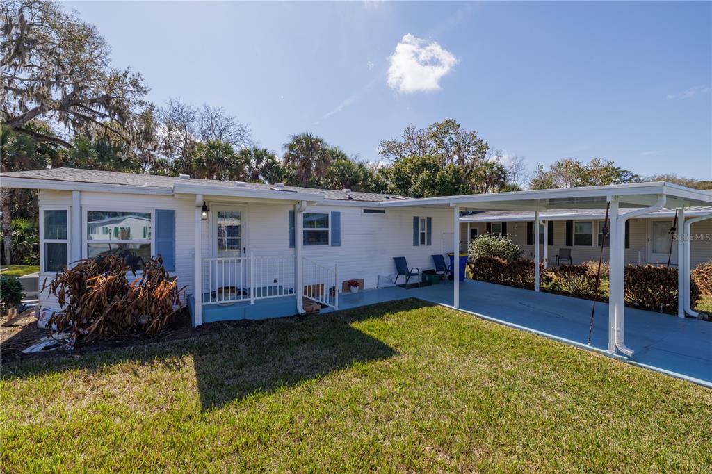 810 Navigators Way Edgewater, FL 32141 - Photo 2 of 34 a view of a house with swimming pool in front of it