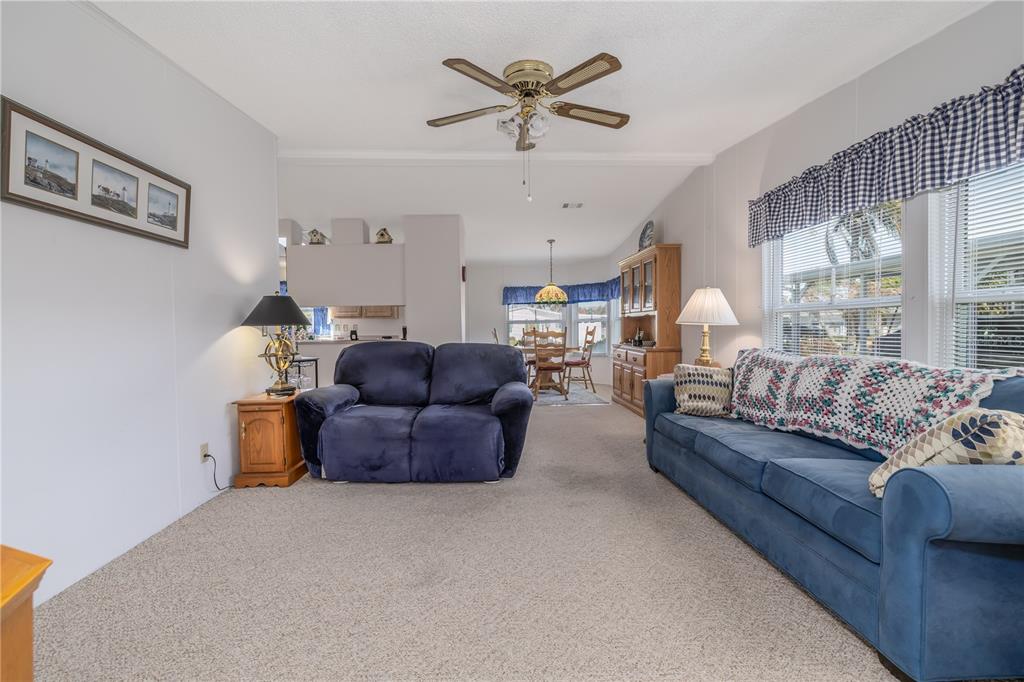 810 Navigators Way Edgewater, FL 32141 - Photo 5 of 34 a living room with furniture and a large window