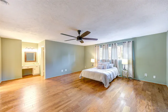 a bedroom with a bed and a lamp