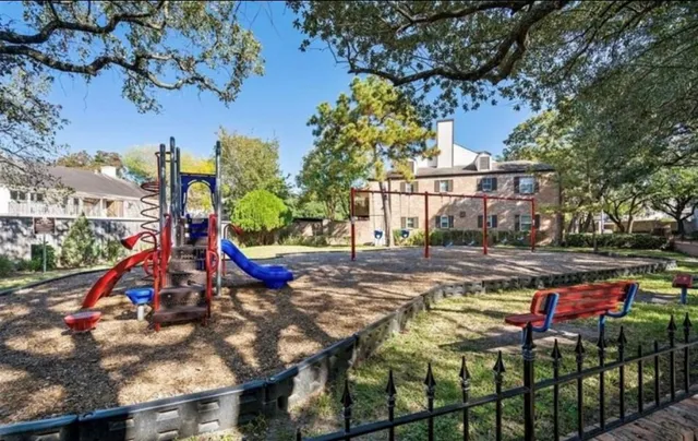 a view of backyard with swimming pool and green space
