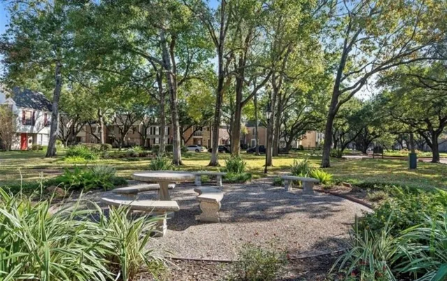 a view of a swimming pool with a yard