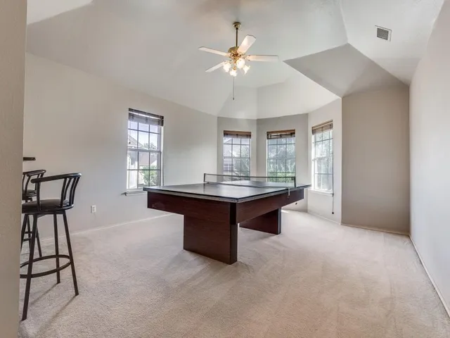 a living room with granite countertop furniture and a chandelier
