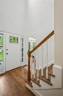 a view of entryway with wooden floor