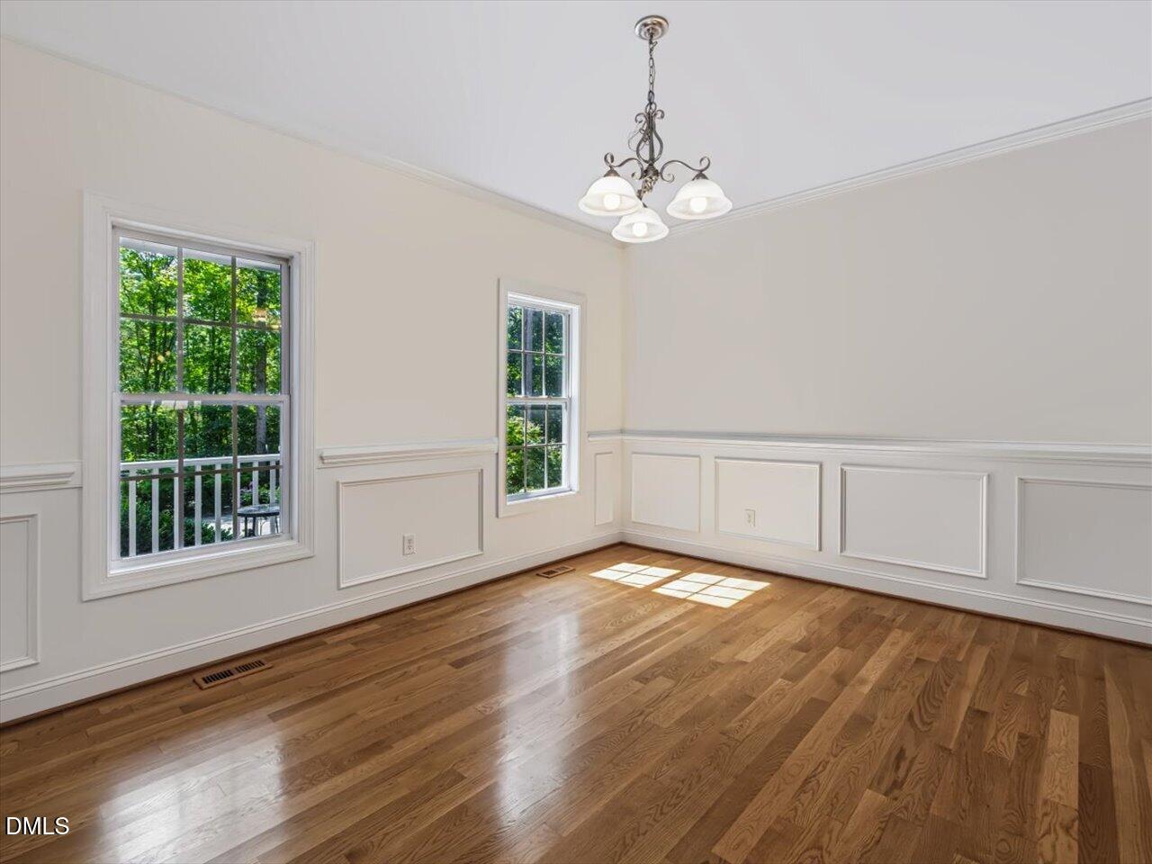 450 Ryan Road Pittsboro, NC 27312 - Photo 10 of 73 Dining Room Featuring -Crown Molding, Wainscoting, and Hardwood Floors