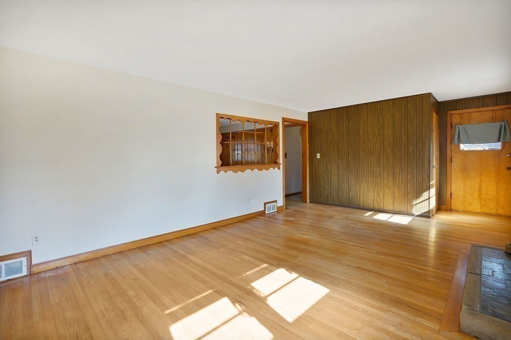 38 Dillon Street Chicopee, MA 01013 - Photo 11 of 19 a view of empty room with wooden floor