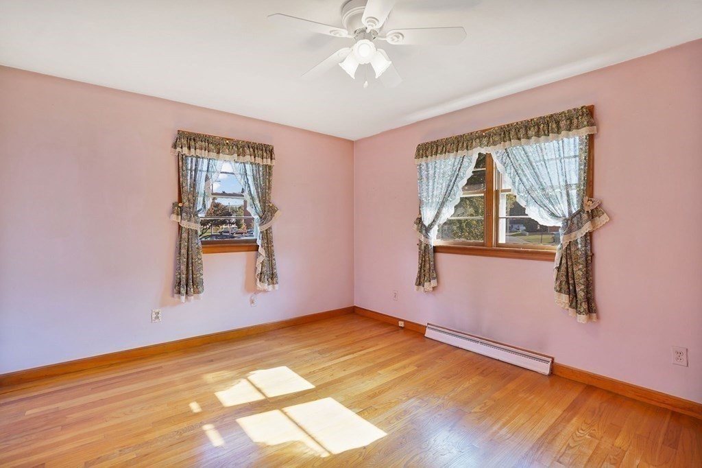 38 Dillon Street Chicopee, MA 01013 - Photo 15 of 19 a view of empty room with wooden floor and fan