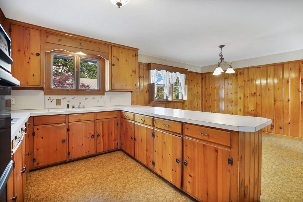 38 Dillon Street Chicopee, MA 01013 - Photo 5 of 19 a bathroom with a sink a vanity and a large mirror