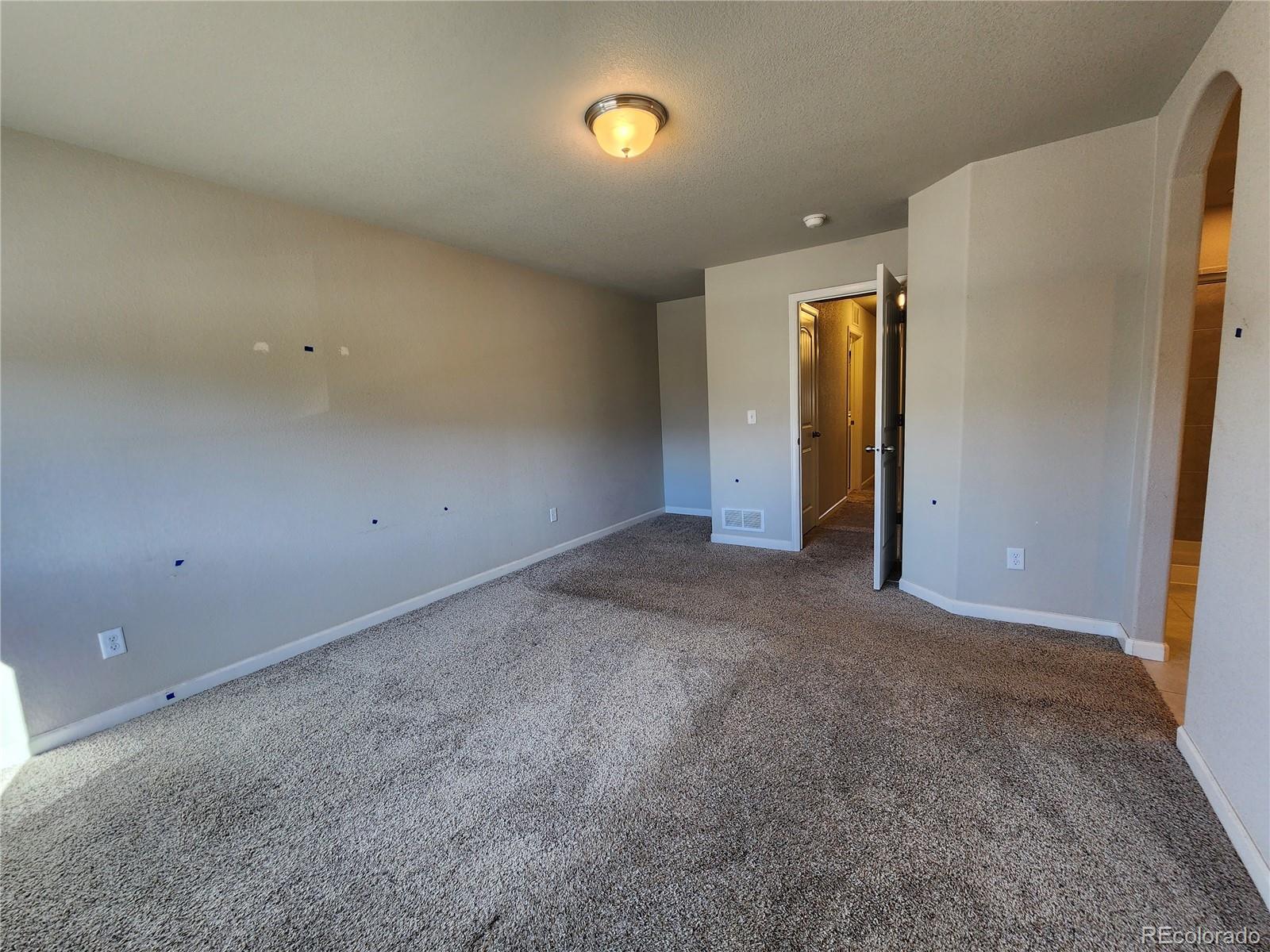 2118 Birmingham Loop Colorado Springs, CO 80910 - Photo 11 of 20 an empty room with closet and mirror
