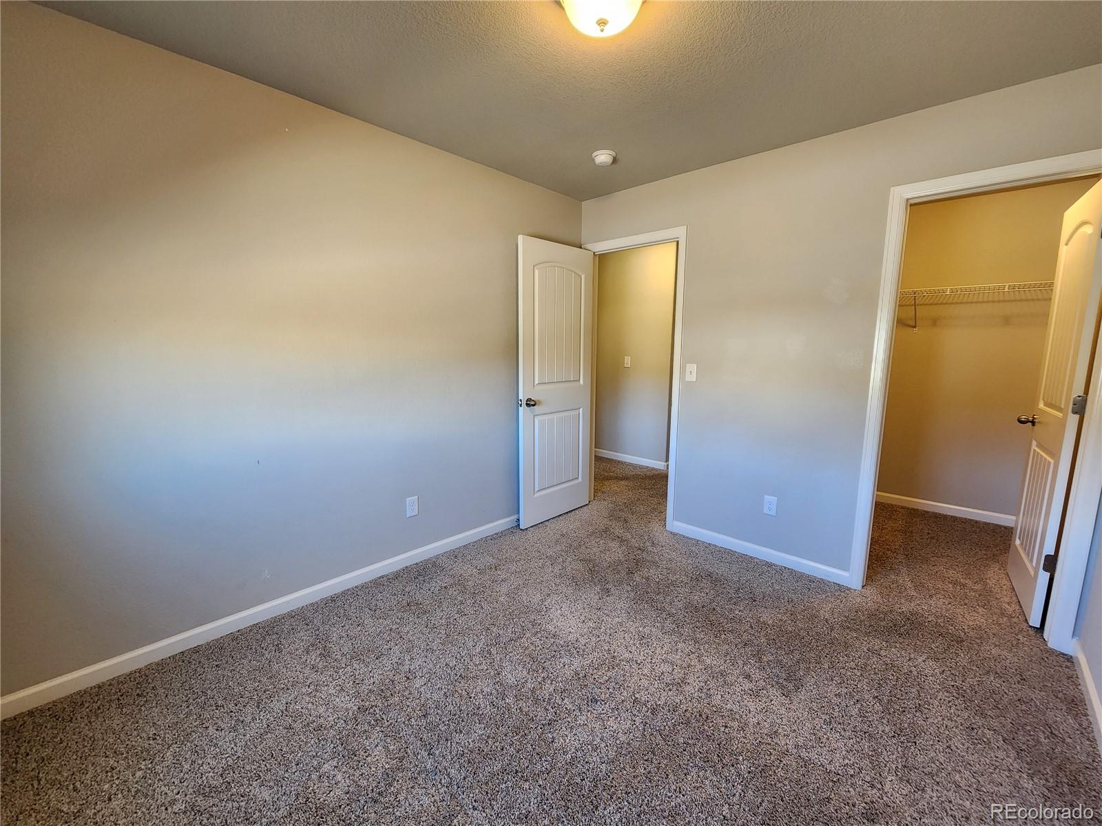 2118 Birmingham Loop Colorado Springs, CO 80910 - Photo 14 of 20 an empty room with closet area