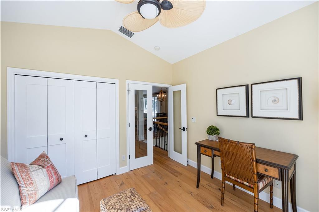 611 10th Avenue South, Unit B2 Naples, FL 34102 - Photo 15 of 27 Office space with lofted ceiling, light wood finished floors, a chandelier, and french doors