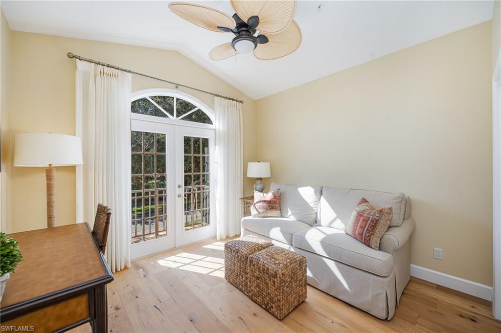 611 10th Avenue South, Unit B2 Naples, FL 34102 - Photo 16 of 27 Sitting room featuring french doors, hardwood / wood-style flooring, lofted ceiling, and a ceiling fan