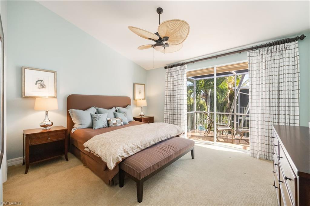 611 10th Avenue South, Unit B2 Naples, FL 34102 - Photo 17 of 27 Carpeted bedroom with access to exterior, vaulted ceiling, and ceiling fan