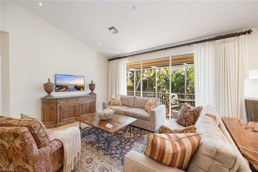 611 10th Avenue South, Unit B2 Naples, FL 34102 - Photo 7 of 27 Living room featuring vaulted ceiling