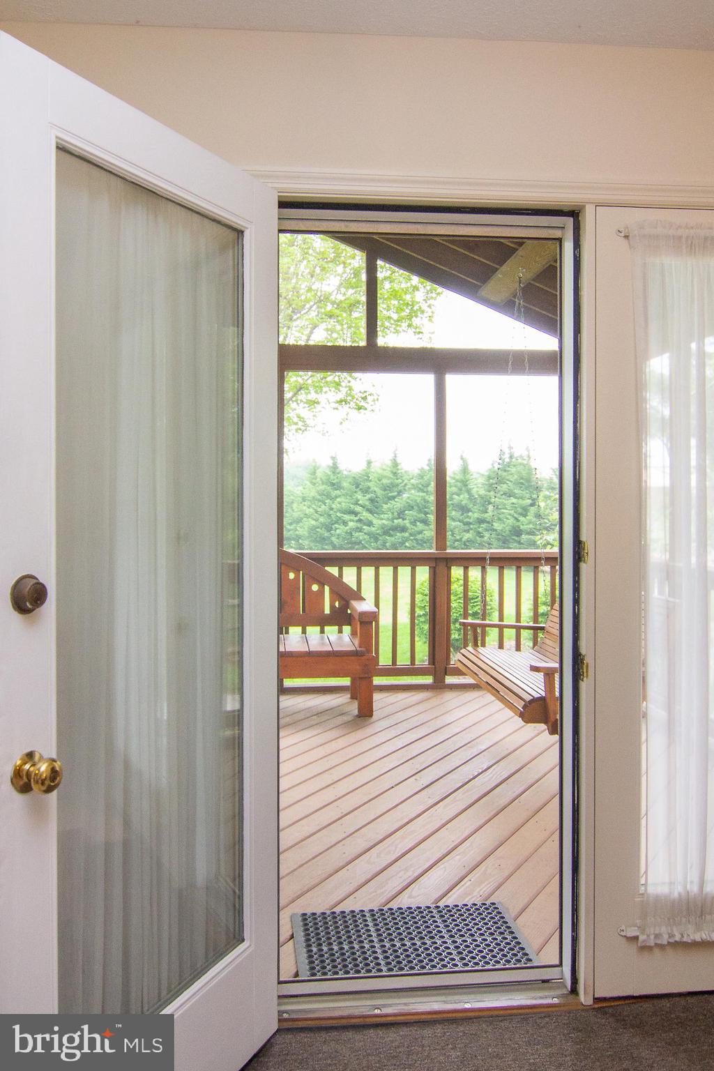 6683 Slacks Road Eldersburg, MD 21784 - Photo 15 of 37 French doors from dining room to screened porch