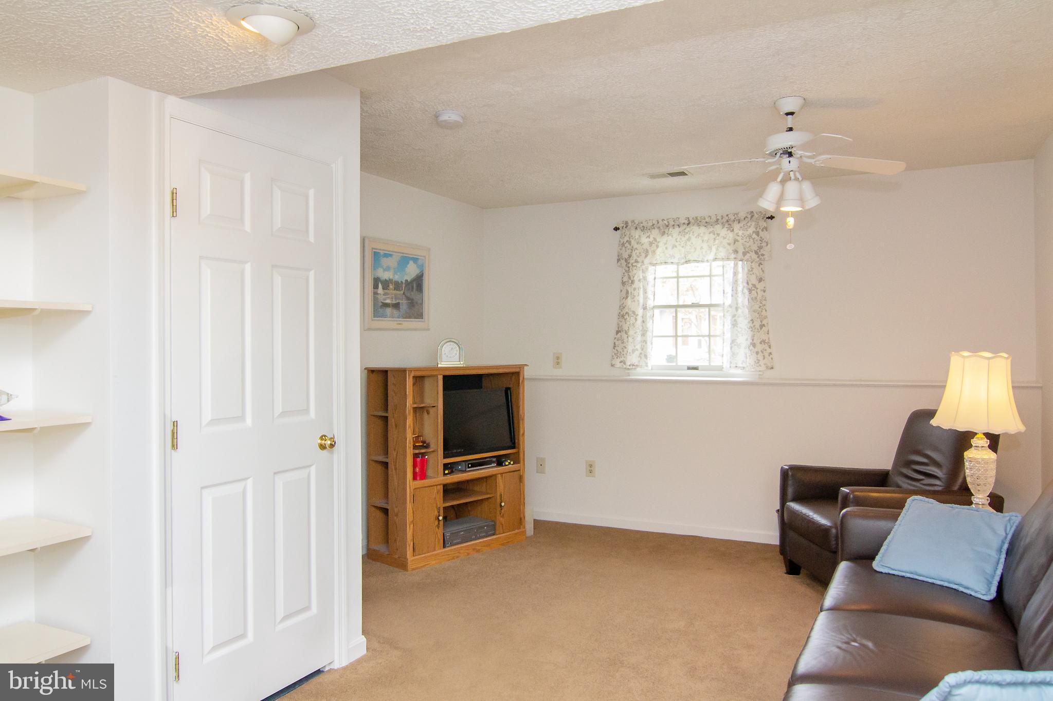 6683 Slacks Road Eldersburg, MD 21784 - Photo 18 of 37 LL Family Room w/ceiling fan and window
