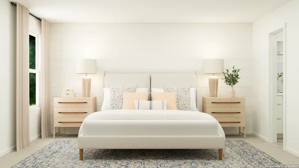 a bedroom with a bed and a cabinets