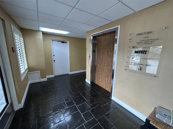 a view of entryway with a front door