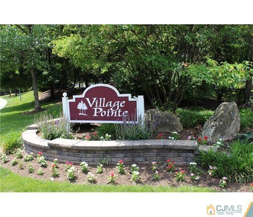 98 Prestwick Way Edison, NJ 08820 - Photo 1 of 16 a view of a park that has a sign board