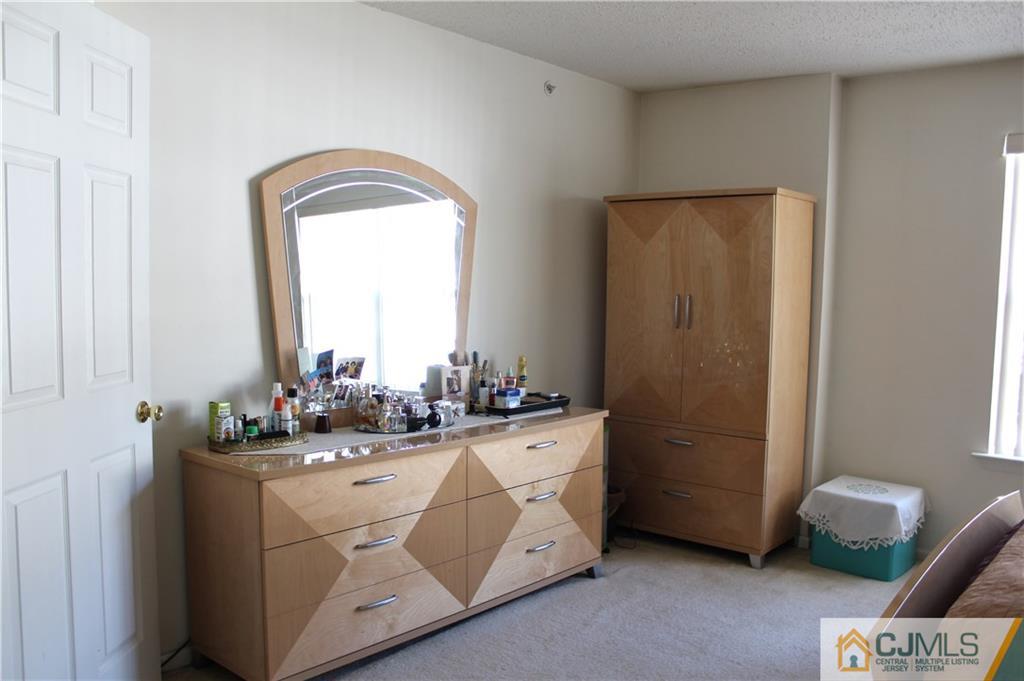 98 Prestwick Way Edison, NJ 08820 - Photo 12 of 16 a room with a sink cabinets and a window