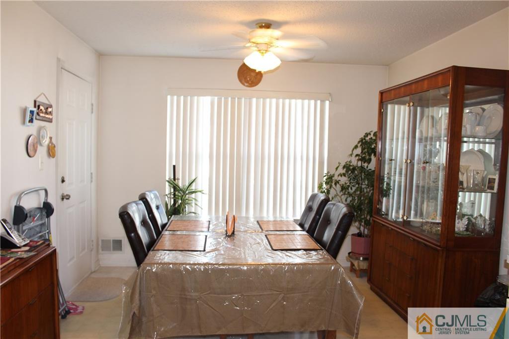 98 Prestwick Way Edison, NJ 08820 - Photo 13 of 16 a living room with furniture and a large window