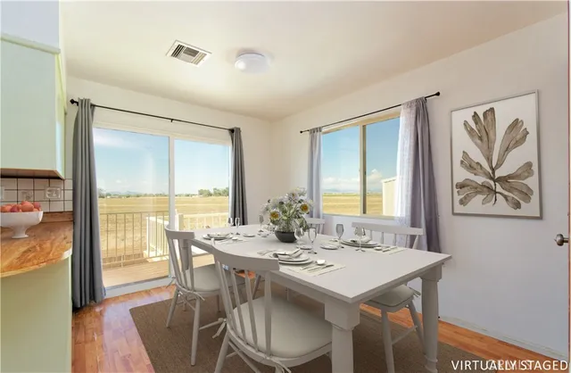 a view of a dining room with furniture window and outside view