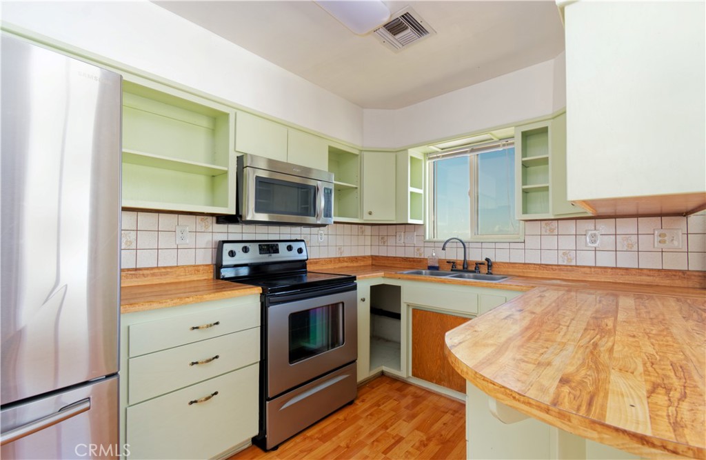 5501 Colorado River Road Blythe, CA 92225 - Photo 20 of 45 a kitchen with granite countertop cabinets stainless steel appliances and a sink