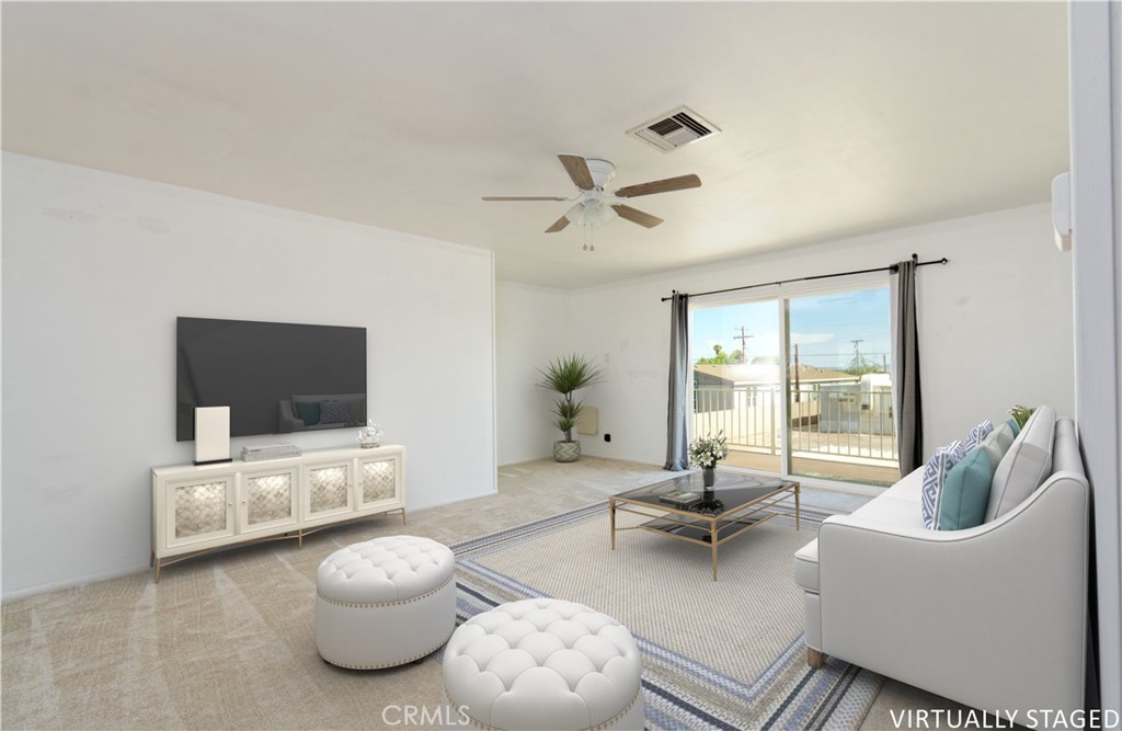 5501 Colorado River Road Blythe, CA 92225 - Photo 24 of 45 a living room with furniture and a flat screen tv