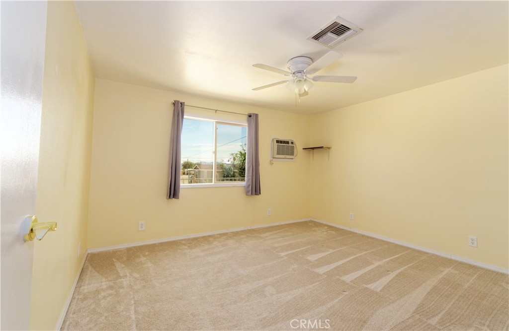 5501 Colorado River Road Blythe, CA 92225 - Photo 28 of 45 an empty room with windows and fan