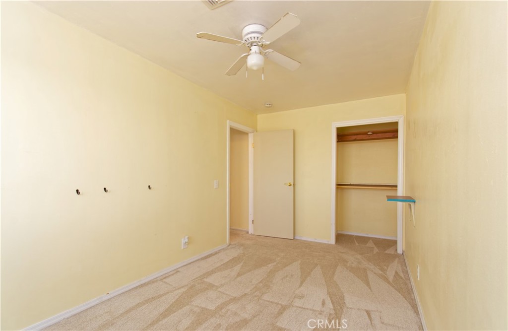 5501 Colorado River Road Blythe, CA 92225 - Photo 37 of 45 a view of a room with a ceiling fan and a hardwood floor