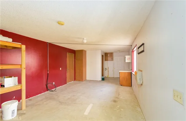 a bedroom with a bed and a cabinets