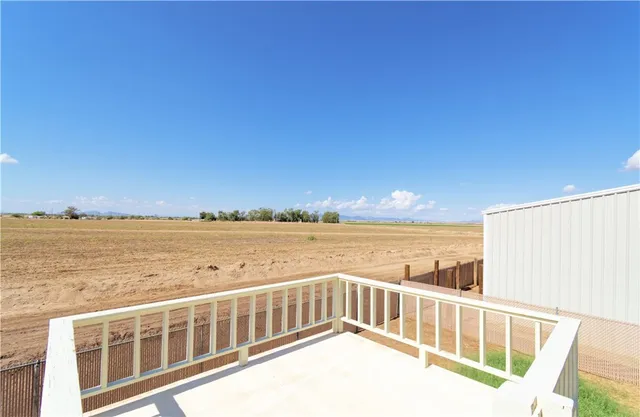a view of a balcony with ocean view