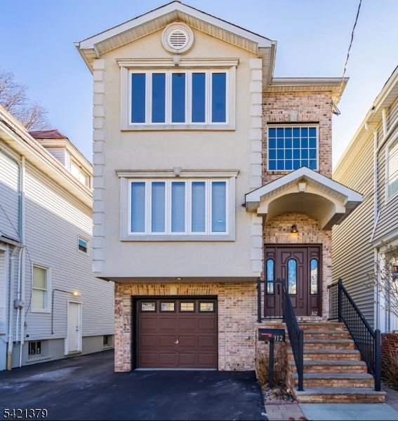 a front view of a house with a balcony