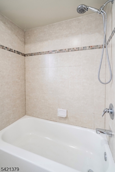 312 Vine Street, Unit 1 Elizabeth, NJ 07202 - Photo 6 of 6 a bathroom with a bathtub and a shower